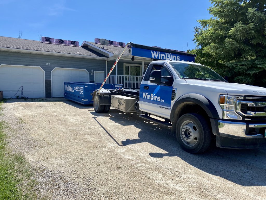 Winnipeg Bin & Dumpster Rentals by WinBins - Ford with Shingles on Roof